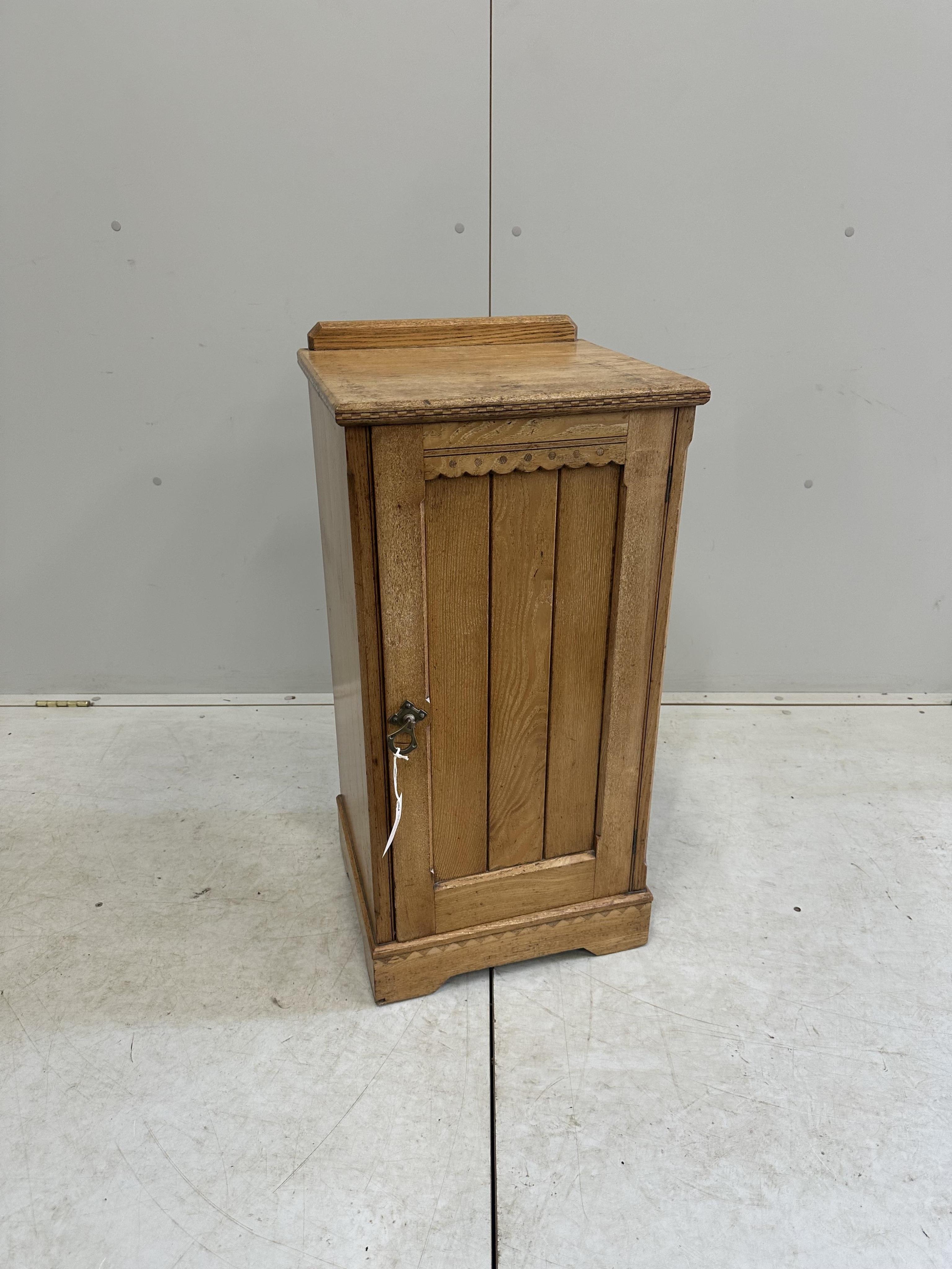 A late Victorian aesthetic movement ash bedside cabinet, width 38cm, depth 35cm, height 80cm. Condition - fair, top stained in places